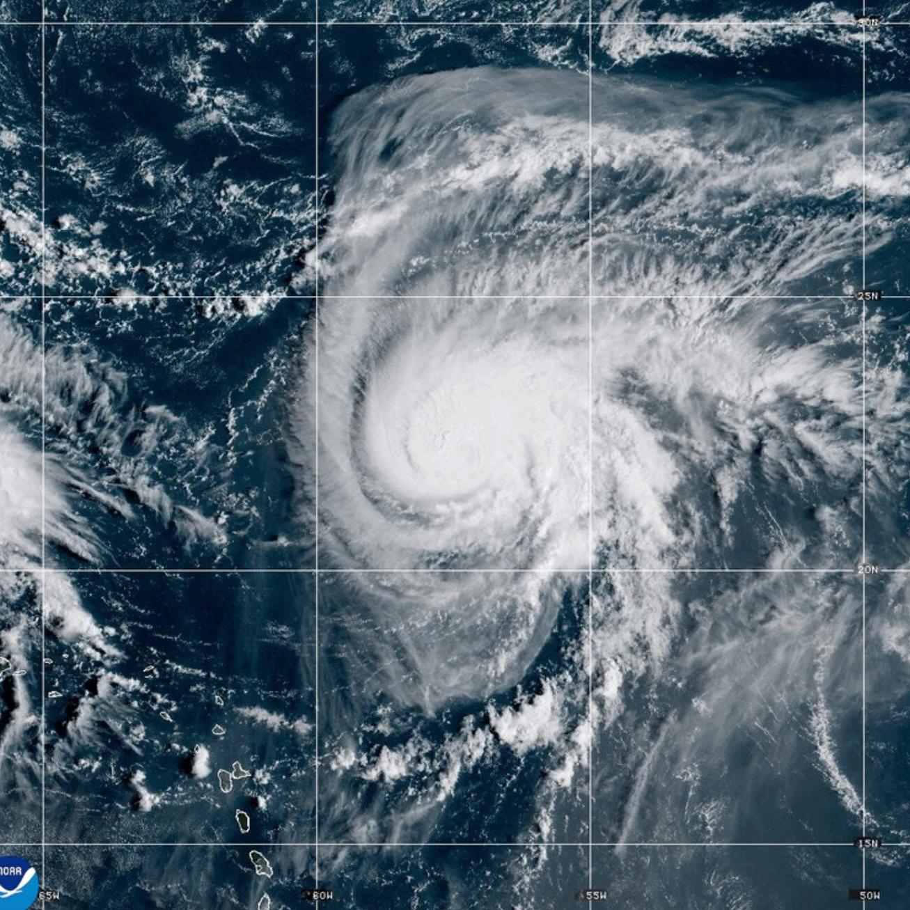Two tropical storm systems near each other could wind up shielding the Carolinas from damage